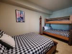 Guest Bedroom with Twin over Full Bunk Bed and Queen Bed